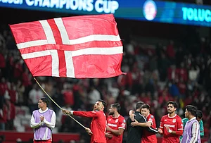 | Photo: AP/Fernando Llano : Alexis Vega of Mexico's Toluca waves a flag after a CONCACAF Champions Cup quarterfinal first leg soccer match against the United States' LA Galaxy in Toluca, Mexico.