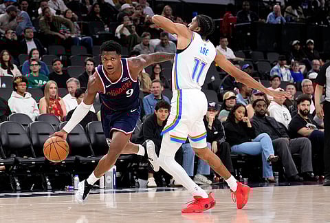 Los Angeles Clippers guard Bennedict Mathurin, left, drives past Oklahoma City Thunder guard Isaiah Joe during the second half of an NBA basketball game in Inglewood, California.