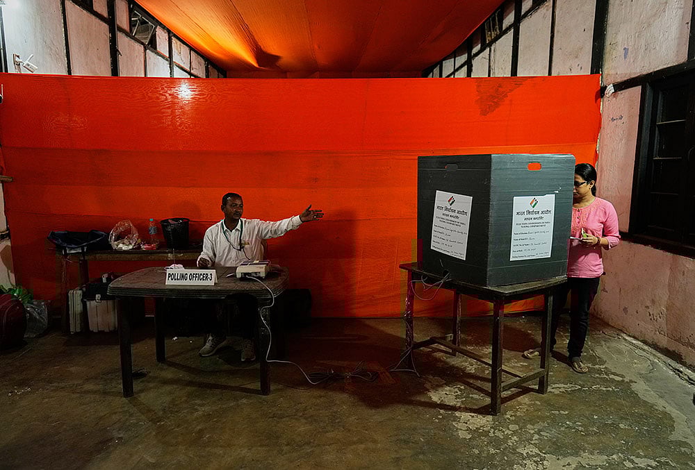 Assembly elections voting A woman casts her vote