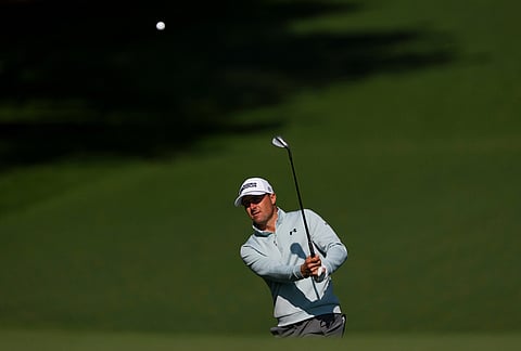 Jordan Spieth chips to the green on the seventh hole during a practice round ahead of the Masters golf tournament at the Augusta National Golf Club, 
in Augusta, Georgia.