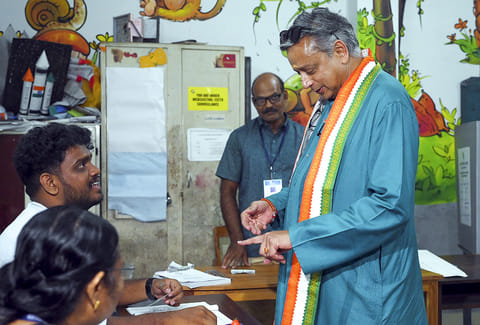 Congress MP Shashi Tharoor casts vote during the Kerala Assembly elections, at a polling station, in Thiruvananthapuram.