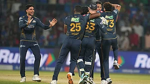 | Photo: AP/Manish Swarup : Gujarat Titans' captain Shubman Gill, left, along with his teammates celebrates after they won the Indian Premier League cricket match against Delhi Capitals in New Delhi.