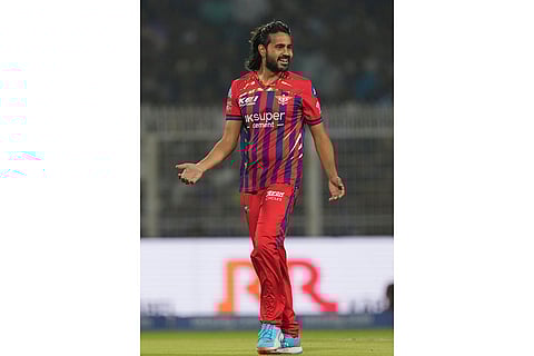 Lucknow Super Giants' Digvesh Rathi celebrates the wicket of Kolkata Knight Riders' captain Ajinkya Rahane during the Indian Premier League cricket match between Kolkata Knight Riders and Lucknow Super Giants in Kolkata, India