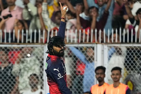 Royal Challengers Bengaluru's Krunal Pandya celebrates the wicket of Rajasthan Royals' captain Riyan Parag during the Indian Premier League cricket match between Royal Challengers Bengaluru and Rajasthan Royals in Guwahati, India.