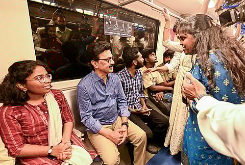 Tamil Nadu Chief Minister MK Stalin interacts with commuters as he travels in a Chennai Metro train as part of an election campaign for the upcoming state Assembly polls, in Chennai. 