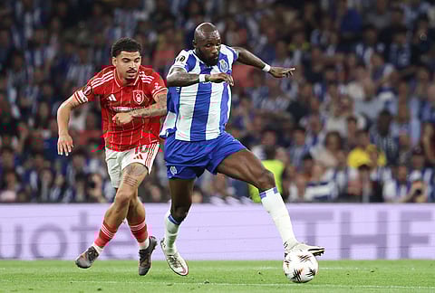 Porto's Seko Fofana runs with the ball ahead of Nottingham Forest's Morgan Gibbs-White during the Europa League quarterfinals, first leg, soccer match between FC Porto and Nottingham Forest in Porto, Portugal.