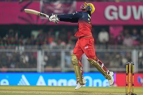 Royal Challengers Bengaluru's Venkatesh Iyer plays a shot during the Indian Premier League cricket match between Royal Challengers Bengaluru and Rajasthan Royals in Guwahati, India.