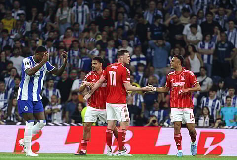 Nottingham Forest players celebrate their first goal during the Europa League quarterfinals, first leg, soccer match between FC Porto and Nottingham Forest in Porto, Portugal.