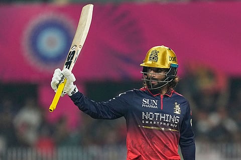Royal Challengers Bengaluru's captain Rajat Patidar celebrates his fifty runs during the Indian Premier League cricket match between Royal Challengers Bengaluru and Rajasthan Royals in Guwahati, India.