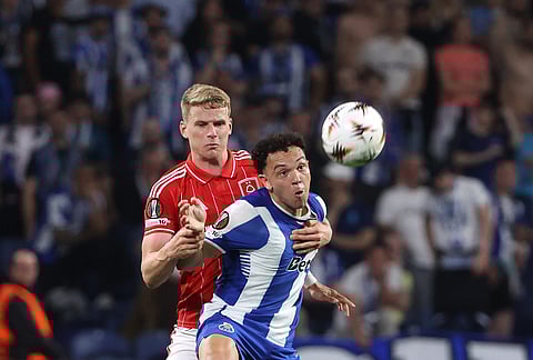 Nottingham Forest's Zach Abbott vies for the ball with Porto's Pepe, right, during the Europa League quarterfinals, first leg, soccer match between FC Porto and Nottingham Forest in Porto, Portugal.