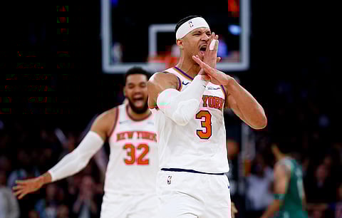 New York Knicks guard Josh Hart (3) reacts after making a 3-point basket in the final minute of an NBA basketball game against the Boston Celtics in New York.