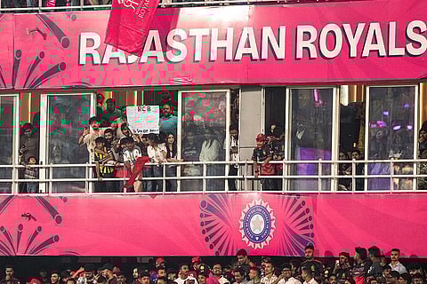 Spectators gather in the stands during the Indian Premier League (IPL) 2026 T20 cricket match between Rajasthan Royals and Royal Challengers Bengaluru, in Guwahati.