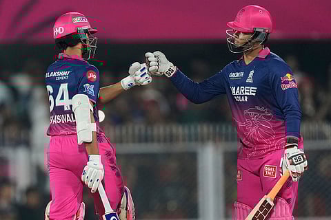 Rajasthan Royals' Vaibhav Sooryavanshi, right and Rajasthan Royals' Yashasvi Jaiswal toss during the Indian Premier League cricket match between Royal Challengers Bengaluru and Rajasthan Royals in Guwahati, India.