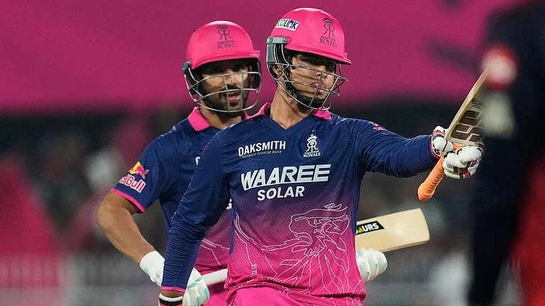 Rajasthan Royals' Vaibhav Sooryavanshi celebrates his fifty runs during the Indian Premier League match against Royal Challengers Bengaluru in Guwahati. - AP/Anupam Nath