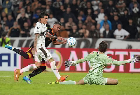 Kayke Ferrari of Brazil's Corinthians, back, scores his side's opening goal against Argentina's Platense during a Copa Libertadores Group E soccer match in Buenos Aires, Argentina.