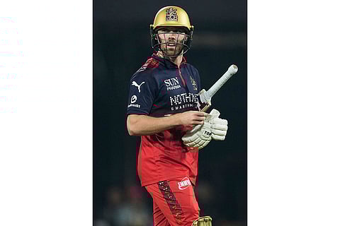 Royal Challengers Bengaluru's Phil Salt leaves the ground after losing his wicket during the Indian Premier League cricket match between Royal Challengers Bengaluru and Rajasthan Royals in Guwahati, India.