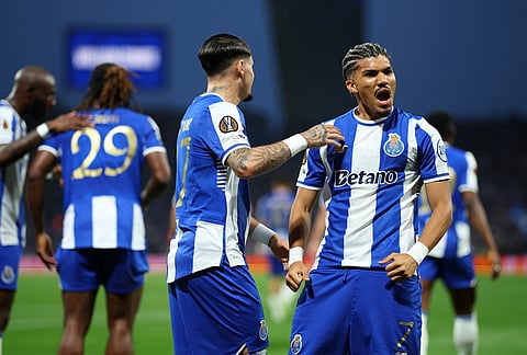 Porto's William Gomes, right, celebrates after scoring the opening goal during the Europa League quarterfinals, first leg, soccer match between FC Porto and Nottingham Forest in Porto, Portugal.