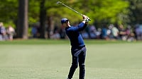 The Masters 2026 Round 1: McIlroy Atop Leaderboard Again; DeChambeau, Rahm Fighting To Make Cut AP/David J. Phillip : Rory McIlroy, of Northern Ireland, hits from the fairway on the 15th hole during the first round of the Masters golf tournament at the Augusta National Golf Club.