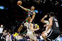 | Photo: AP/Yuki Iwamura : Brooklyn Nets guard Tyson Etienne (10) goes up to shoot over Indiana Pacers guard Taelon Peter (4) during the second half of an NBA basketball game in New York. 