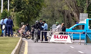 PTI : Islamabad: Security personnel check commuters at a barricade amid heightened security measures ahead of US-Iran talks, for which authorities have announced a two-day holiday, in Islamabad, Pakistan, Thursday, April 9, 2026.