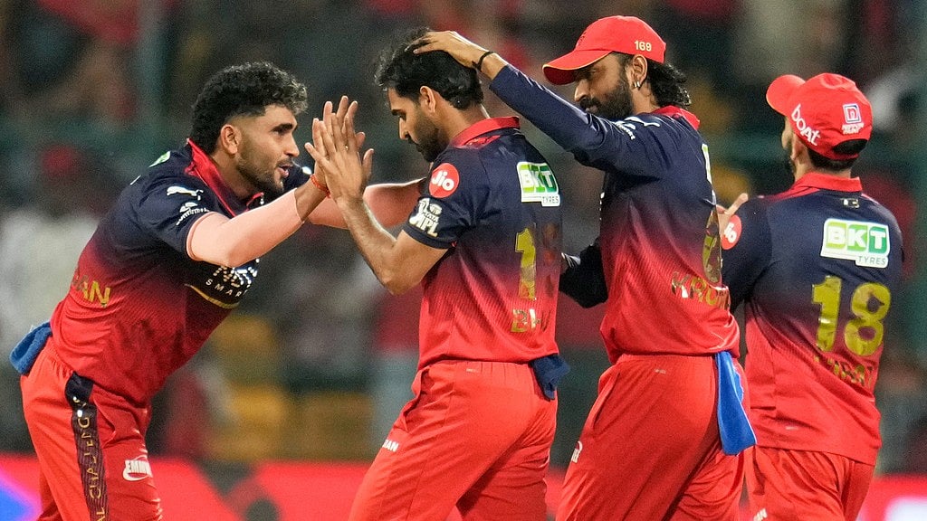 Royal Challengers Bengaluru's Bhuvneshwar Kumar, second left, celebrates with teammates the wicket of Chennai Super Kings' Ayush Mhatre during their Indian Premier League match in Bengaluru. - Aijaz Rahi