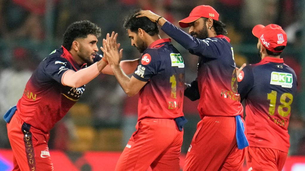 Aijaz Rahi : Royal Challengers Bengaluru's Bhuvneshwar Kumar, second left, celebrates with teammates the wicket of Chennai Super Kings' Ayush Mhatre during their Indian Premier League match in Bengaluru.