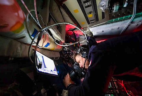 Artemis II crew member captures science data and takes photos out of the Orion spacecraft window to share with their team back on Earth. 