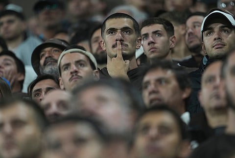 Fans of Argentina's Platense react during a Copa Libertadores Group E soccer match against Brazil's Corinthians in Buenos Aires, Argentina.