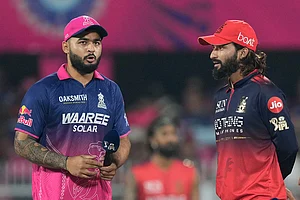 | Photo: AP/Anupam Nath : Rajasthan Royals' captain Riyan Parag, left talks with Royal Challengers Bengaluru's captain Rajat Patidar prior to the coin toss of the Indian Premier League cricket match between Royal Challengers Bengaluru and Rajasthan Royals in Guwahati, India.