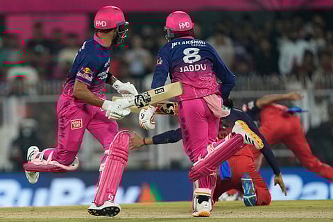 Rajasthan Royals' Ravindra Jadeja and Rajasthan Royals' Dhruv Jurel run between the wickets during the Indian Premier League cricket match between Royal Challengers Bengaluru and Rajasthan Royals in Guwahati, India.