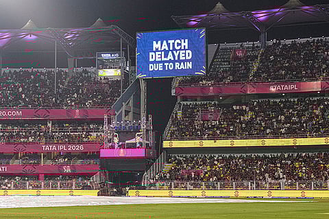  A screen displays 'Match delayed due to rain' ahead of an Indian Premier League (IPL) 2026 T20 cricket match between Rajasthan Royals and Royal Challengers Bengaluru, in Guwahati.