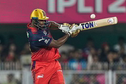 Royal Challengers Bengaluru's Romario Shepherd plays a shot during the Indian Premier League cricket match between Royal Challengers Bengaluru and Rajasthan Royals in Guwahati, India.