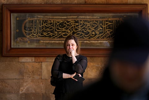 The daughter of Mohammad Zein al-Abedin Shehab, who was killed in an Israeli airstrike a day earlier, appears emotional during his funeral procession in Beirut, Lebanon, Thursday, April 9, 2026. 