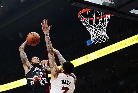 Toronto Raptors' Brandon Ingram (3) tries to dunk over Miami Heat's Kel'el Ware (7) unsuccessfully during the first half of an NBA basketball game in Toronto.
