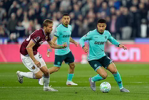 West Ham United's Tomas Soucek left, and Wolverhampton Wanderers' Joao Gomes battle for the ball during their English Premier League soccer match in London.