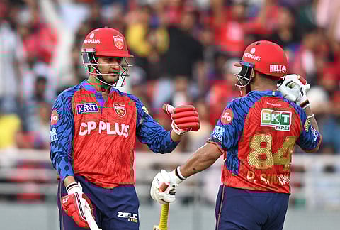 Punjab Kings' Priyansh Arya, left, celebrates scoring runs with batting partner Prabhsimran Singh during the Indian Premier League cricket match between Punjab Kings and Sunrisers Hyderabad in New Chandigarh.
