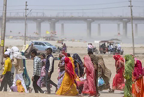 Prime Minister Narendra Modi greets during a public rally ahead of the West Bengal Assembly elections, in Jangipur, Murshidabad district, West Bengal.