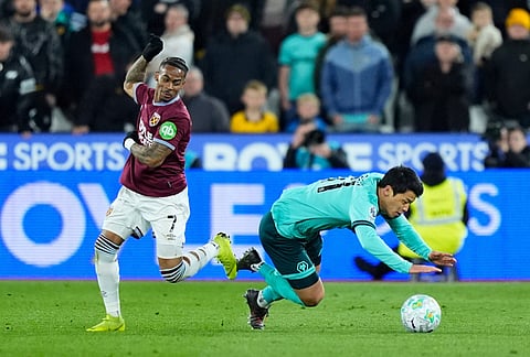 West Ham United's Crysencio Summerville, left, and Wolverhampton Wanderers' Hwang Hee-Chan battle for the ball during their English Premier League soccer match in London.