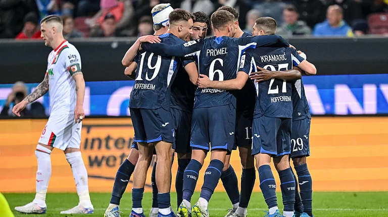 Hoffenheim's Bazoumana Toure celebrates with teammates after scoring during the German Bundesliga soccer match between FC Augsburg and TSG 1899 Hoffenheim in Augsburg, Germany, Friday, April 10, 2026. - | Photo: dpa/Harry Langer via AP