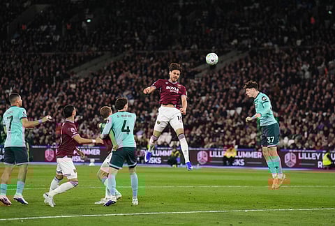 West Ham United's Konstantinos Mavropanos, center, scores their side's first goal of the game during their English Premier League soccer match against Wolverhampton Wanderers in London.