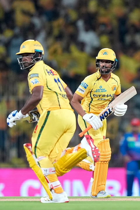 Chennai Super Kings' Sanju Samson, left, and Chennai Super Kings' captain Ruturaj Gaikwad run between the wickets to score during the Indian Premier League cricket match between Chennai Super Kings and Delhi Capitals in Chennai.