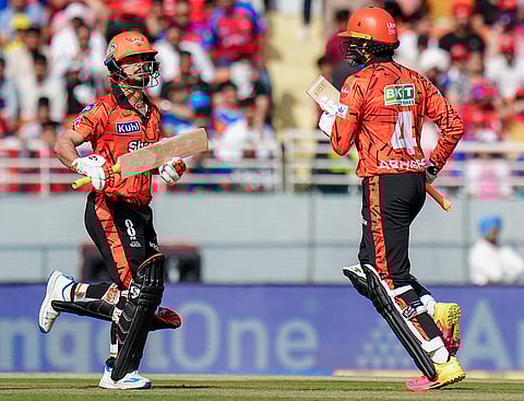 Sunrisers Hyderabad's captain Ishan Kishan, left, and Abhishek Sharma run between the wickets during the Indian Premier League (IPL) 2026 cricket match between Punjab Kings and Sunrisers Hyderabad, at MYS Cricket Stadium in Mullanpur, New Chandigarh.

