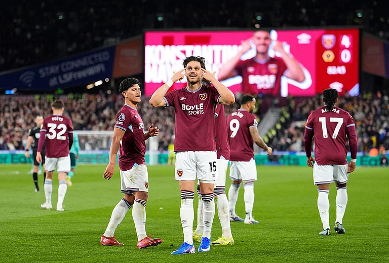 West Ham United's Konstantinos Mavropanos celebrates scoring their side's fourth goal of the game during their English Premier League soccer match against Wolverhampton Wanderers in London.
- | Photo: Jordan Pettitt/PA via AP