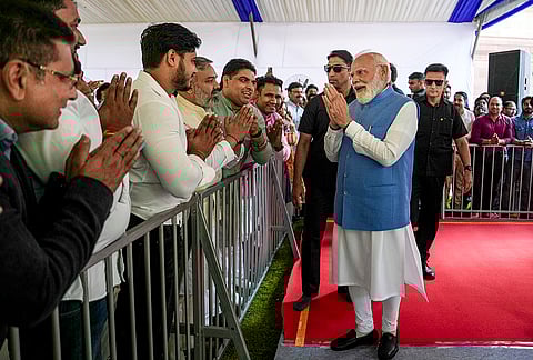 Minister Narendra Modi being greeted by visitors during the 200th birth anniversary celebration of Mahatma Jyotiba Phule, at the Parliament premises, in New Delhi.