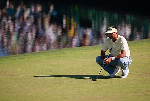 Jason Day, of Australia, lines up a putt on the 15th hole during the second round of the Masters golf tournament at the Augusta National Golf Club in Augusta, Georgia. 