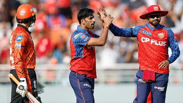 Punjab Kings cricketers wearing black armbands during IPL 2026 clash against Sunrisers Hyderabad at Mullanpur. - IPL/X
