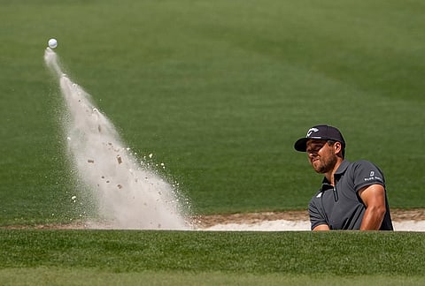 Xander Schauffele hits from the bunker on the second hole during the second round of the Masters golf tournament at the Augusta National Golf Club, in Augusta, Georgia. 