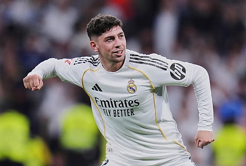 Real Madrid's Federico Valverde celebrates after scoring the opening goal during a Spanish La Liga soccer match between Real Madrid and Girona in Madrid, Spain.