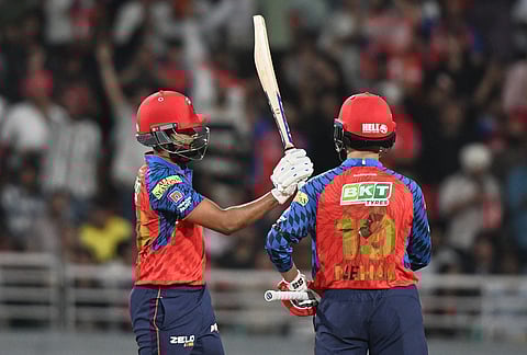 Punjab Kings' captain Shreyas Iyer, left, celebrates his fifty runs during the Indian Premier League cricket match between Punjab Kings and Sunrisers Hyderabad in New Chandigarh.