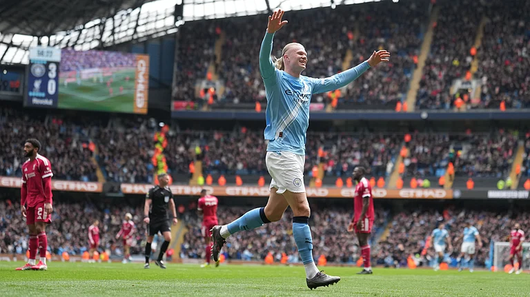 Manchester City's Erling Haaland celebrates after scoring his third goal during the FA Cup quarter-final soccer match between Manchester City and Liverpool in Manchester, England, Saturday, April 4, 2026. - | Photo: AP/Jon Super